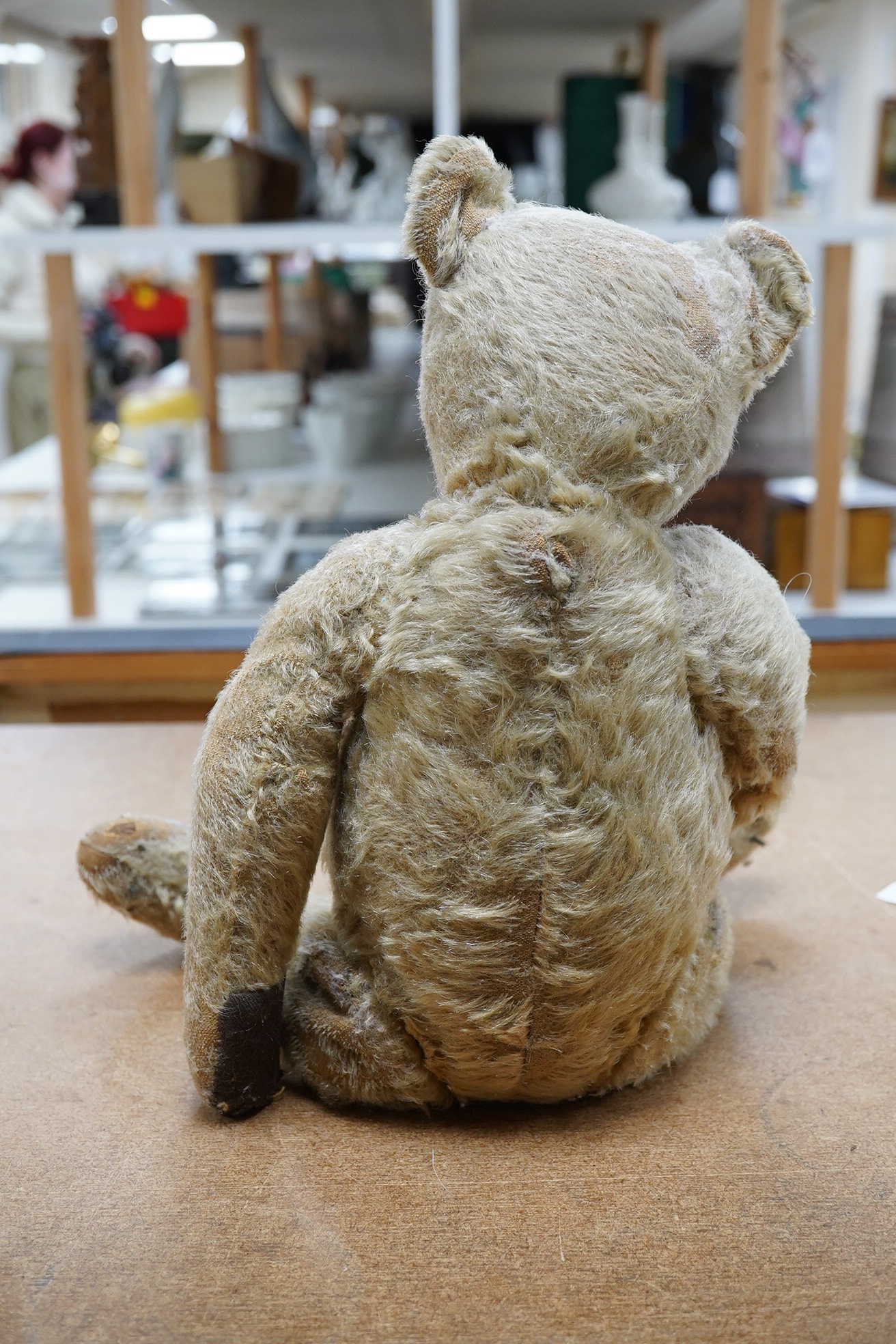 Steiff bear, circa 1910, nose repaired, holes to muzzle, hair loss, paw pads replaced, height 41cm